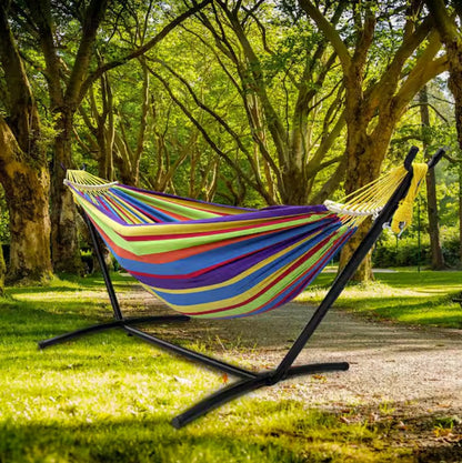 Double Hammock with Stand surrounded by lights – ideal for creating a cozy backyard relaxation hammock atmosphere.
