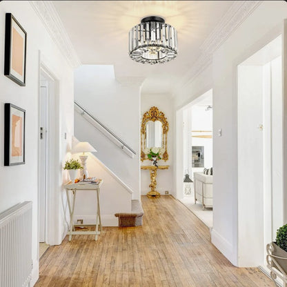 Modern LED crystal pendant light illuminating a stylish interior hallway with elegance.