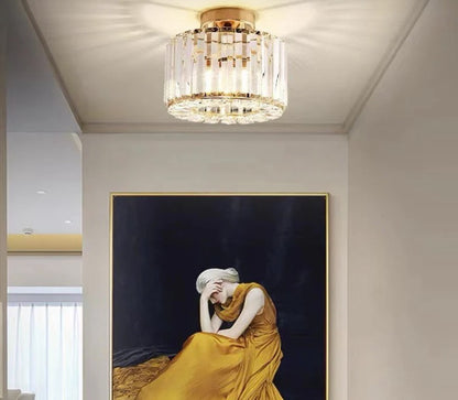 Sleek modern LED crystal pendant light shown above kitchen island, exemplifying minimalist style.