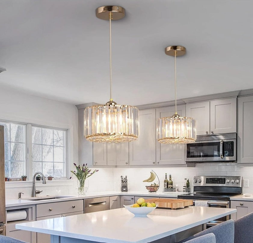 Beautiful modern LED crystal pendant light over a dining area, emanating a cozy ambiance.