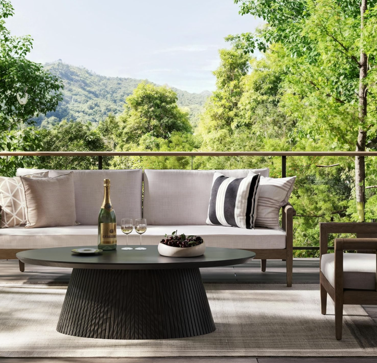 A living room featuring the Mid Century Modern Oval Coffee Table, showcasing contemporary elegance.