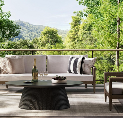 A living room featuring the Mid Century Modern Oval Coffee Table, showcasing contemporary elegance.
