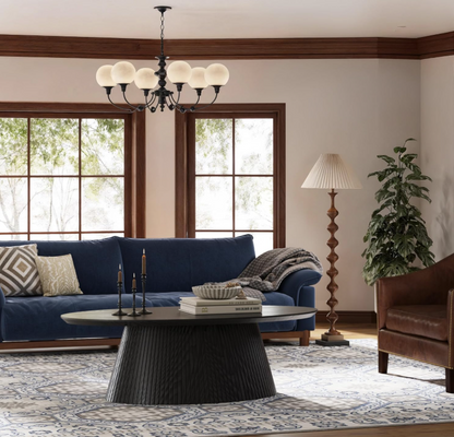 Mid Century Modern Coffee Table adorned with design books and a ceramic vase for a curated look.