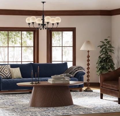 The generous surface area of the Mid Century Modern Oval Coffee Table, ideal for drinks and décor.