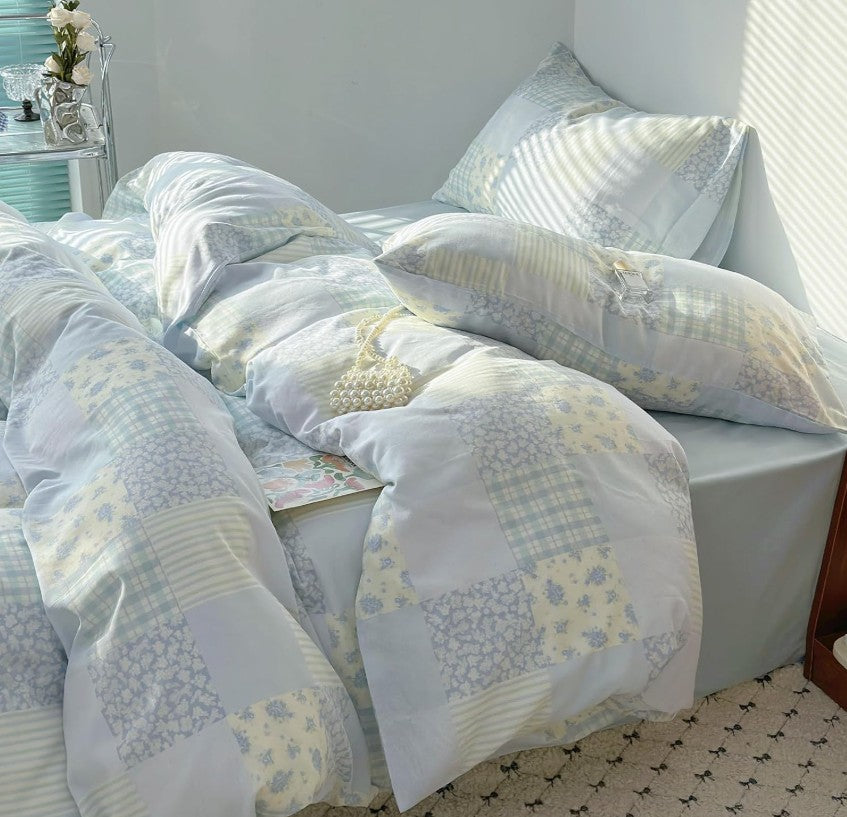 Colorful detail of Blue Floral Patchwork Cotton Gauze Duvet Cover Set, demonstrating fade-resistant fabric and vibrant floral designs.