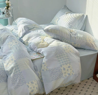 Colorful detail of Blue Floral Patchwork Cotton Gauze Duvet Cover Set, demonstrating fade-resistant fabric and vibrant floral designs.