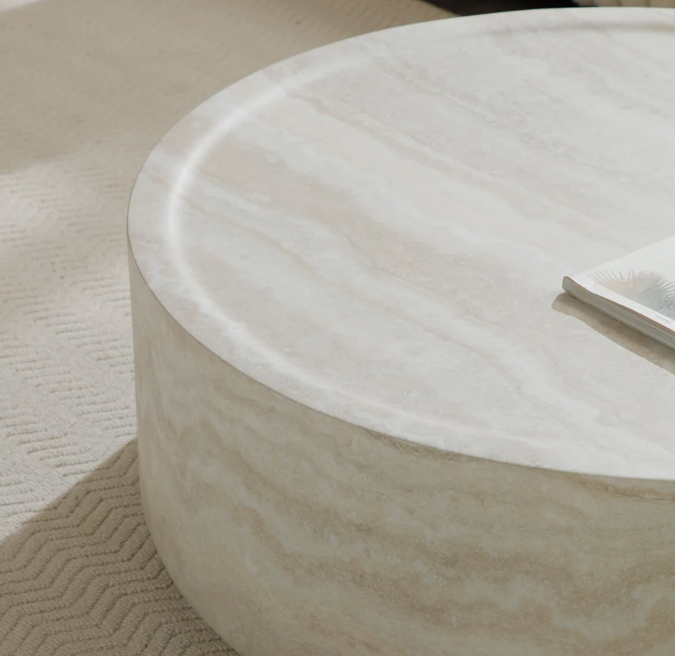Chic faux marble coffee table with drum shape, perfect for a contemporary living area.