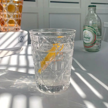 Beautiful Hand-Carved 6-Piece Cut-Crystal Tumblers Set showcasing craftsmanship and vibrant colors.