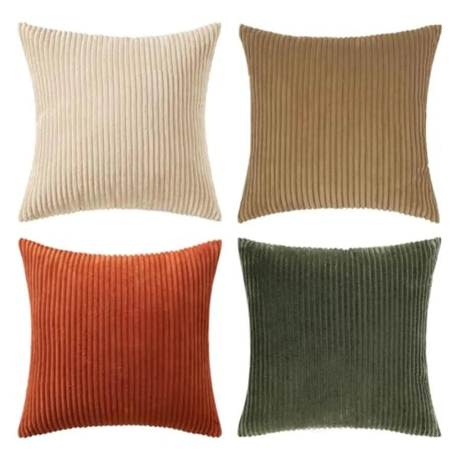 Four ribbed texture throw pillows in beige, brown, orange, and green on a white background.