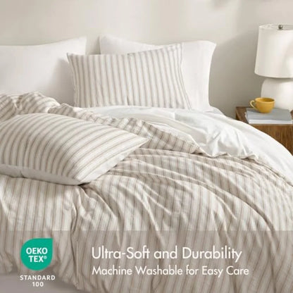 Artistic arrangement of the Luxury Linen Blend Striped Duvet Cover Set complemented by matching shams, enhancing a modern organic style in bedroom decor.