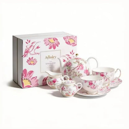 Aynsley 7-Piece Tea Set features cups and saucers elegantly arranged for an afternoon tea gathering.