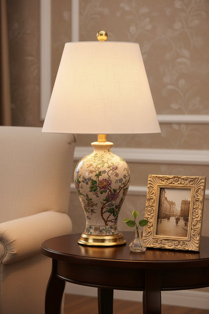 Lifestyle shot featuring the Elegant 24" Multicolor Ceramic Floral LED Table Lamp with Golden Base in a cozy living room setting, a perfect multicolor table lamp.