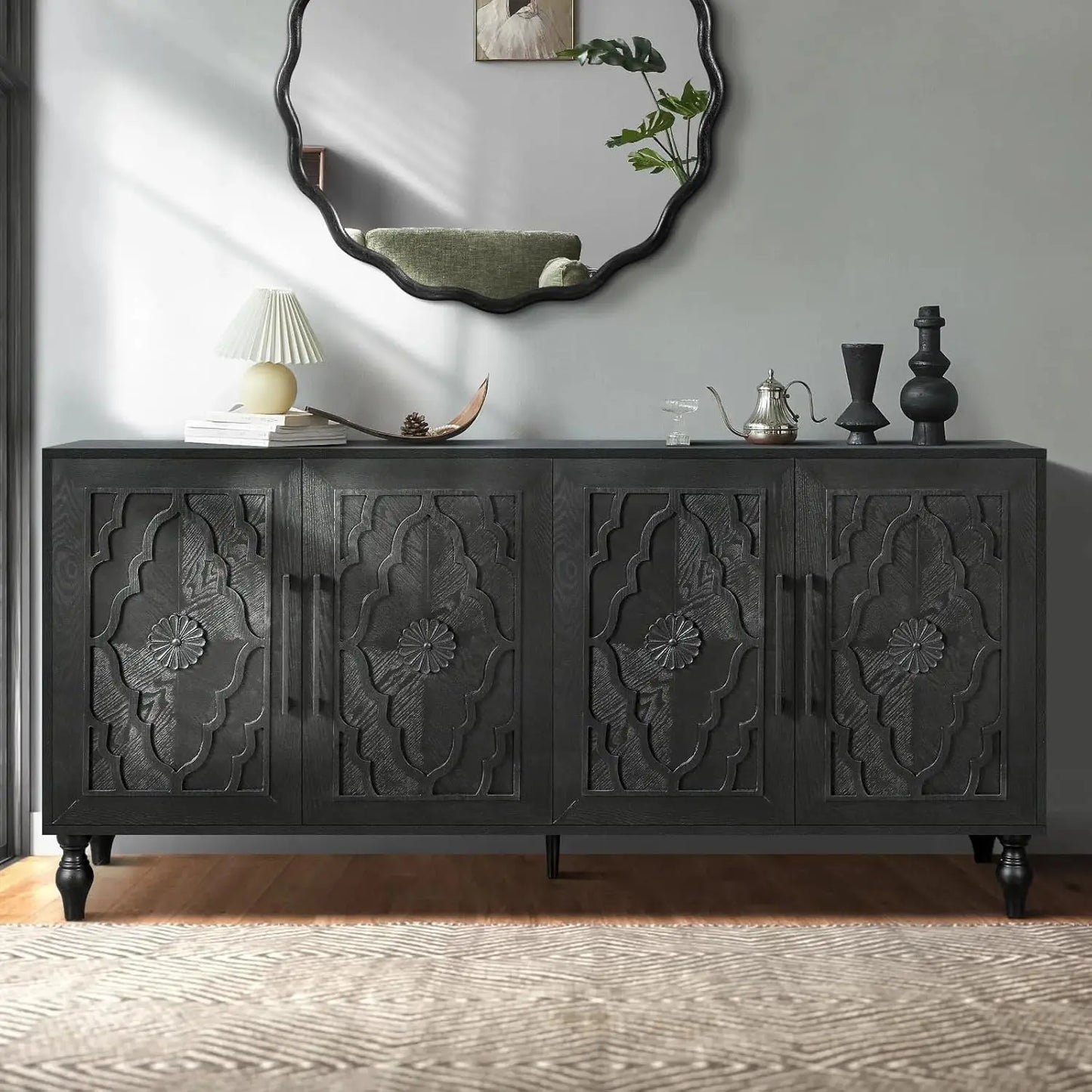 Antique Black Carved Sideboard with Carved Flower Doors styled with warm lighting and neutral décor, perfect for enhancing your home with an antique carved sideboard focal point.