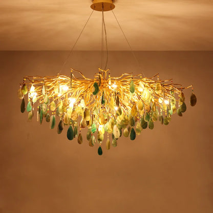 Elegant art deco chandelier illuminating a dining area with warm LED light, highlighting its colorful agate design.
