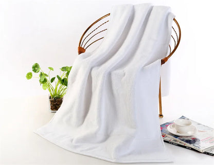 Ultra-Soft High-Absorbency Terry Bath Towel rolled and stacked, demonstrating its lightweight cotton design and high absorbency for daily use.