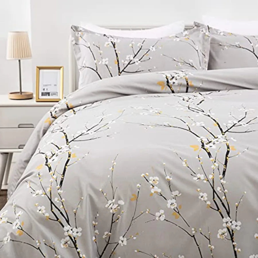 A cozy corner featuring the Sage Green & Yellow Floral Duvet Cover Set Queen, highlighting the gentle texture of the microfiber fabric and the botanical-inspired design.
