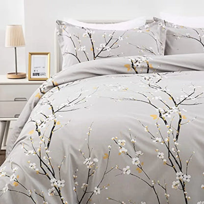 A cozy corner featuring the Sage Green & Yellow Floral Duvet Cover Set Queen, highlighting the gentle texture of the microfiber fabric and the botanical-inspired design.