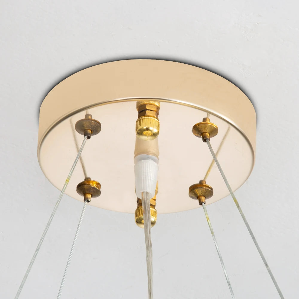 Elegant Gold Luxury Crystal Chandelier styled with elegant furnishings, emphasizing the glamour of this luxurious gold crystal chandelier.
