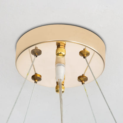 Elegant Gold Luxury Crystal Chandelier styled with elegant furnishings, emphasizing the glamour of this luxurious gold crystal chandelier.