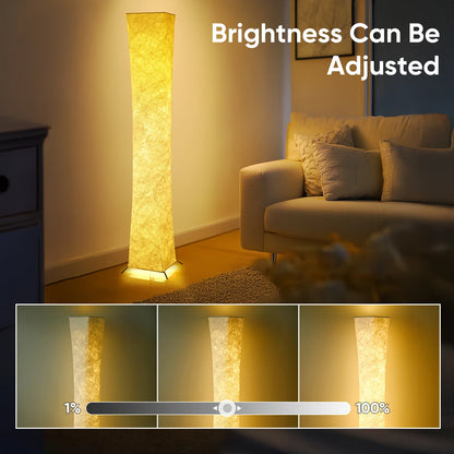 The 64-Inch Dimmable Floor Lamp in a cozy reading nook, demonstrating its ambiance-enhancing capabilities.