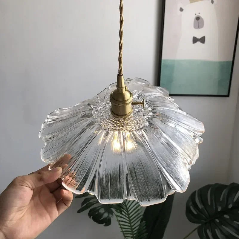 Multiple Artisan Lotus Leaf Pendant Lights hung over a dining table creating a stylish centerpiece, featuring the lotus leaf pendant light.