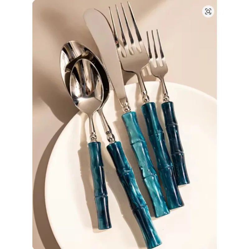 Stylish setting of Flatware Set showing 18/10 stainless steel cutlery with bamboo-inspired handles, demonstrating its versatile use for casual and formal dining.