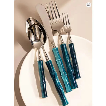 Stylish setting of Flatware Set showing 18/10 stainless steel cutlery with bamboo-inspired handles, demonstrating its versatile use for casual and formal dining.
