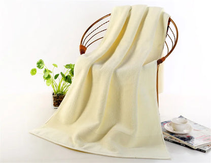 Ultra-Soft High-Absorbency Terry Bath Towels arranged in a beautiful display, highlighting the variety of colors and high absorbency features.