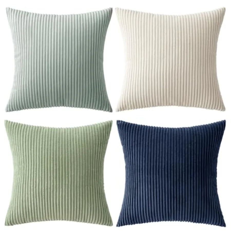 Four ribbed texture throw pillows in green, blue, and beige on a white background