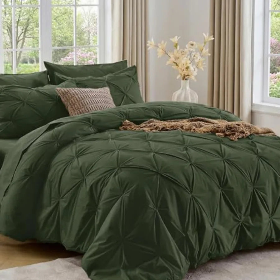 The Queen 7-Piece Pintuck Comforter Set features plush microfiber material that guarantees a cozy, restful night’s sleep every time.