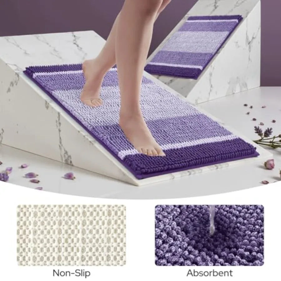 Stylish and practical, the purple Chenille Bath Mats, 2-Piece Set absorb water quickly and keep floors dry.