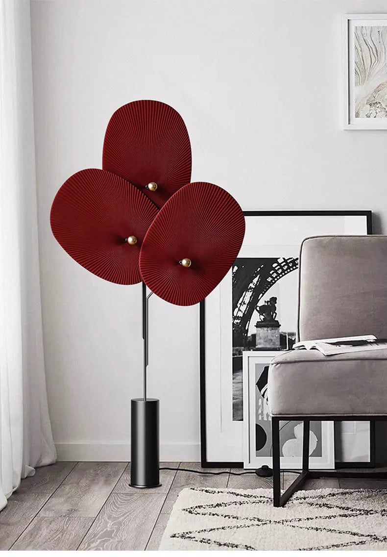 Elegant Modern Triple Floral Floor Lamp positioned next to a cozy armchair.