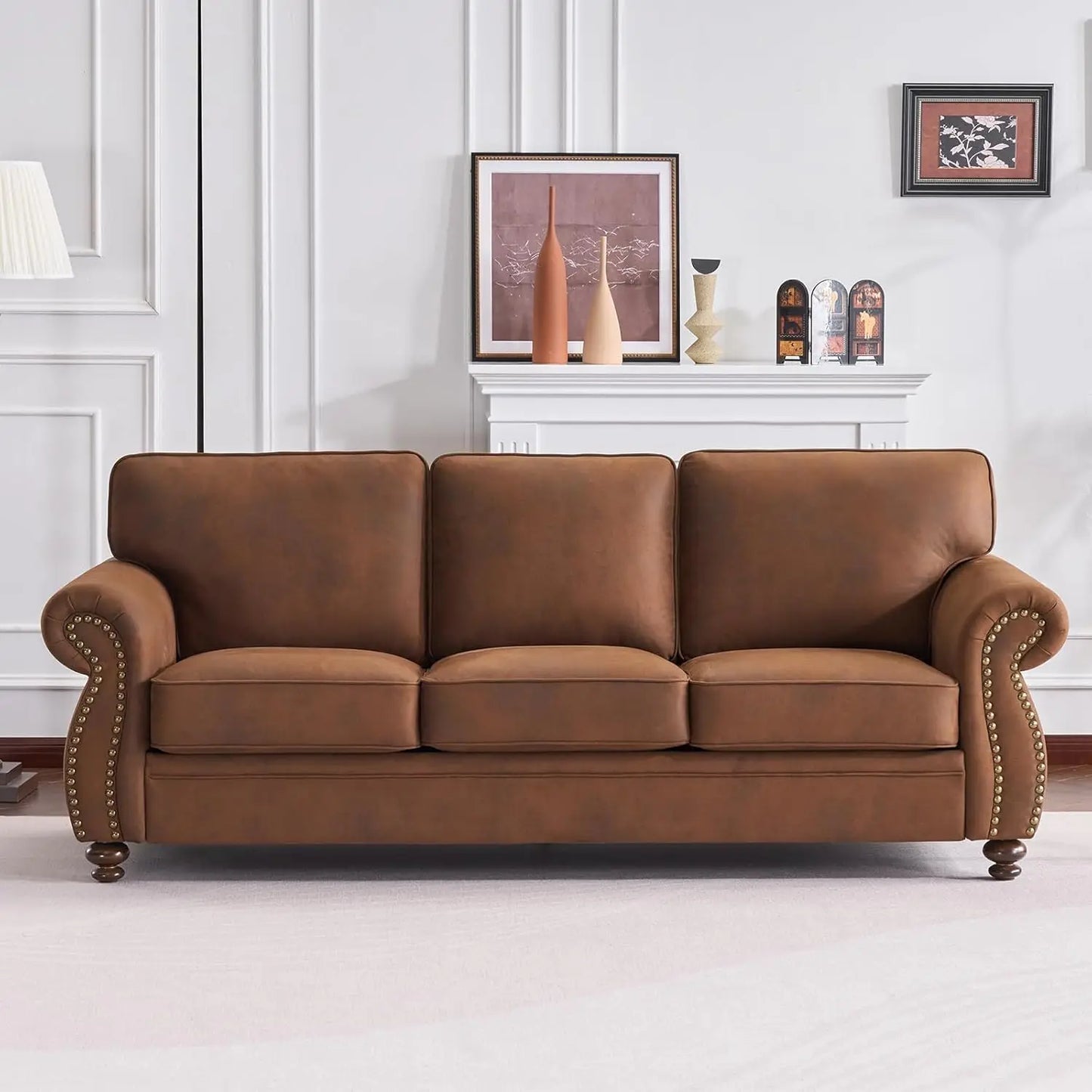 Front view of 88” Farmhouse Rolled Arm Sofa with Nailhead Trim, showcasing its elegant design and leather-look fabric.