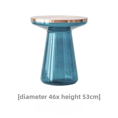 Luxurious Modern Round Coffee Table placed next to a stylish sofa, enhancing the living room aesthetics.