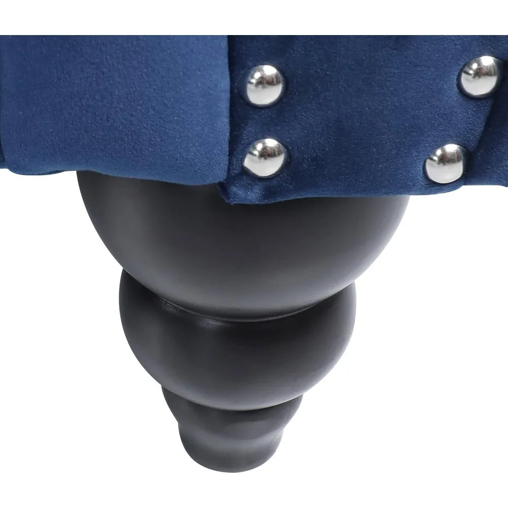 Blue Velvet Chesterfield Sofa – 84" tufted 3-seater couch placed against a textured wall, enhancing modern décor.