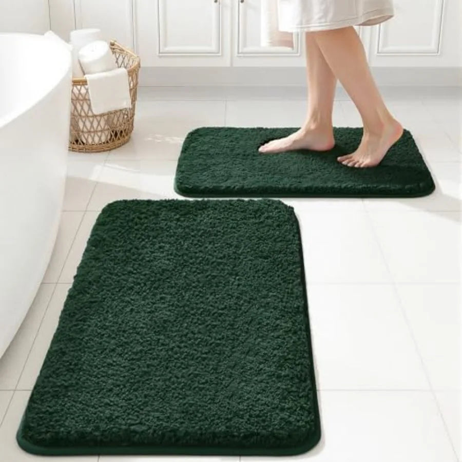 Close-up view of the non-slip backing on the 2-Piece Dark Green Microfiber Bath Rug Set for added safety.