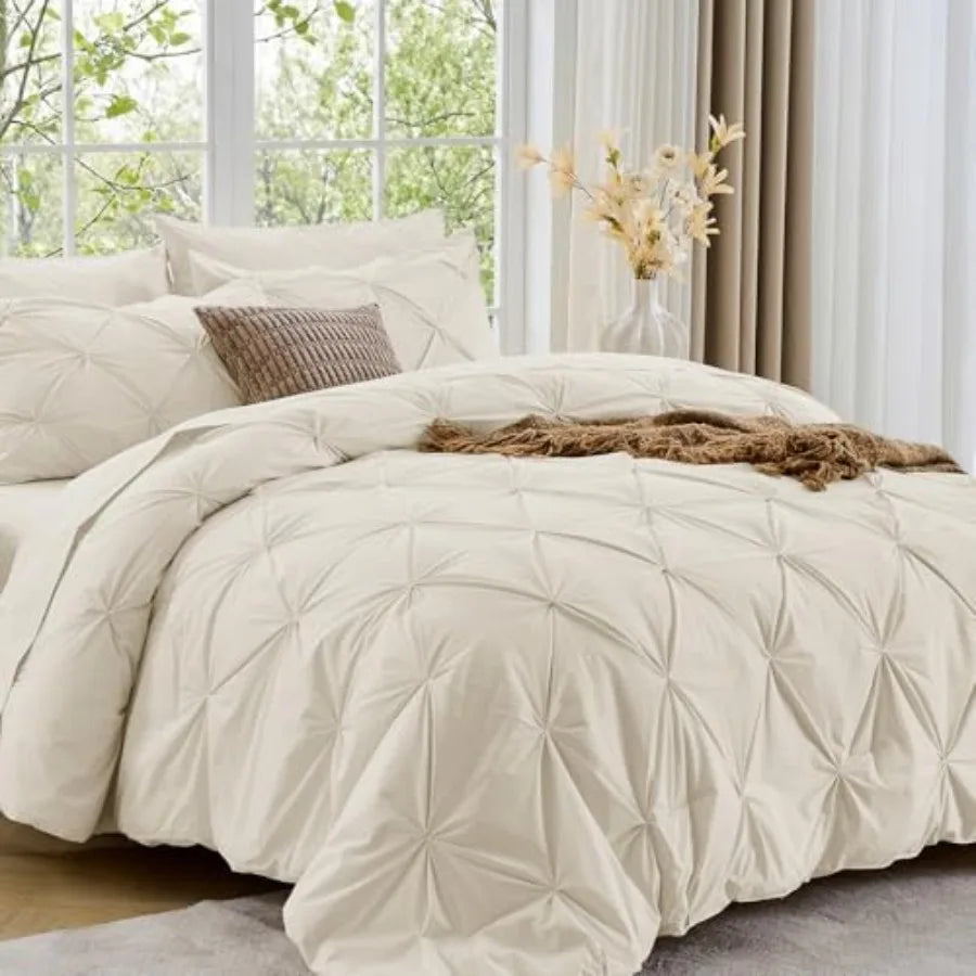 The luxurious Queen 7-Piece Pintuck Comforter Set provides a graceful touch to your bedroom while ensuring cozy warmth throughout all seasons.