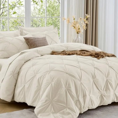 The luxurious Queen 7-Piece Pintuck Comforter Set provides a graceful touch to your bedroom while ensuring cozy warmth throughout all seasons.