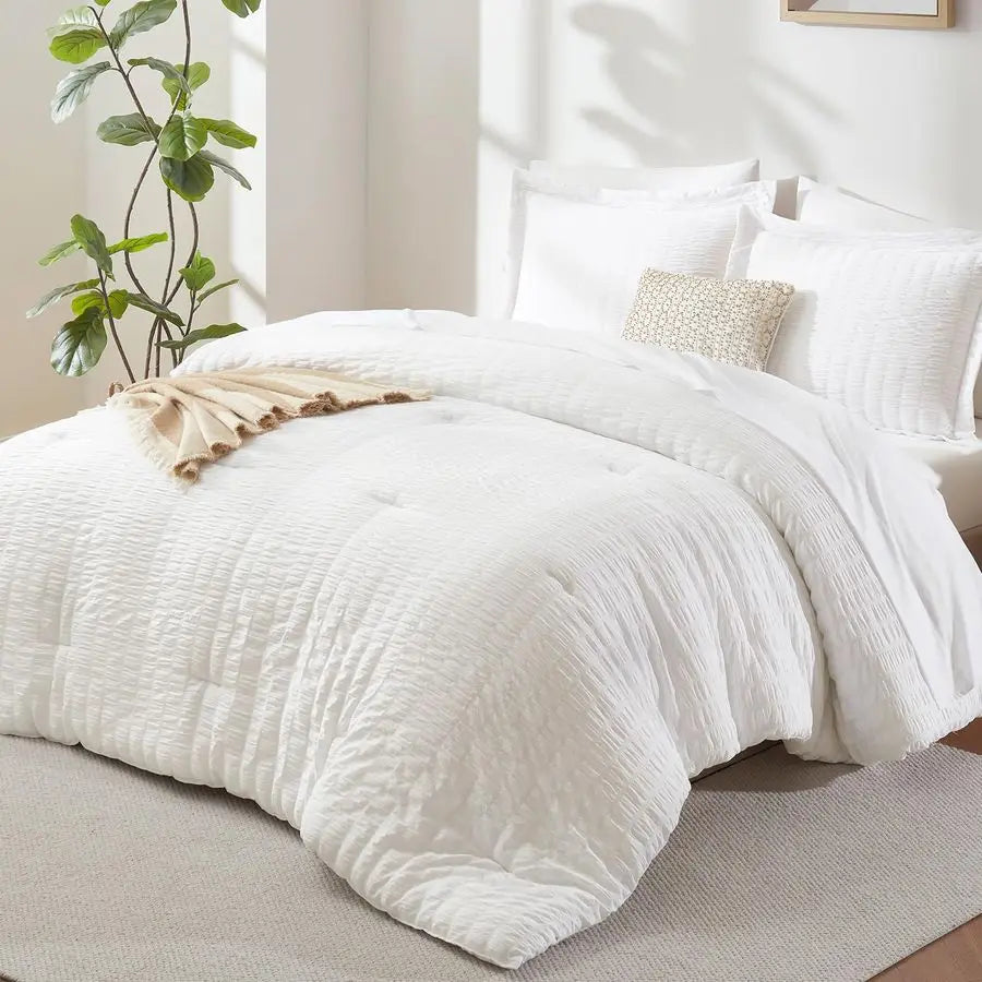 7-Piece Luxury Queen Bedding Set in Winter White featuring a soft down alternative comforter and elegant sheet set.