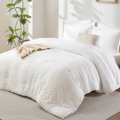 7-Piece Luxury Queen Bedding Set in Winter White featuring a soft down alternative comforter and elegant sheet set.