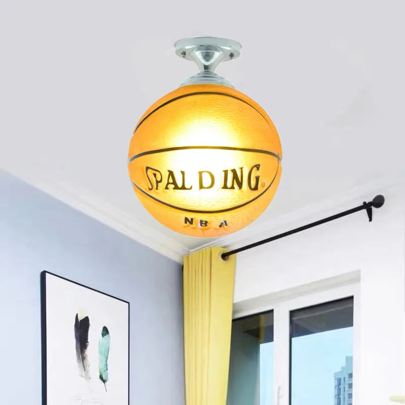 Image of the Retro Hanging Basketball LED Light Fixture with bright lighting, showcasing its industrial style in a modern setting.