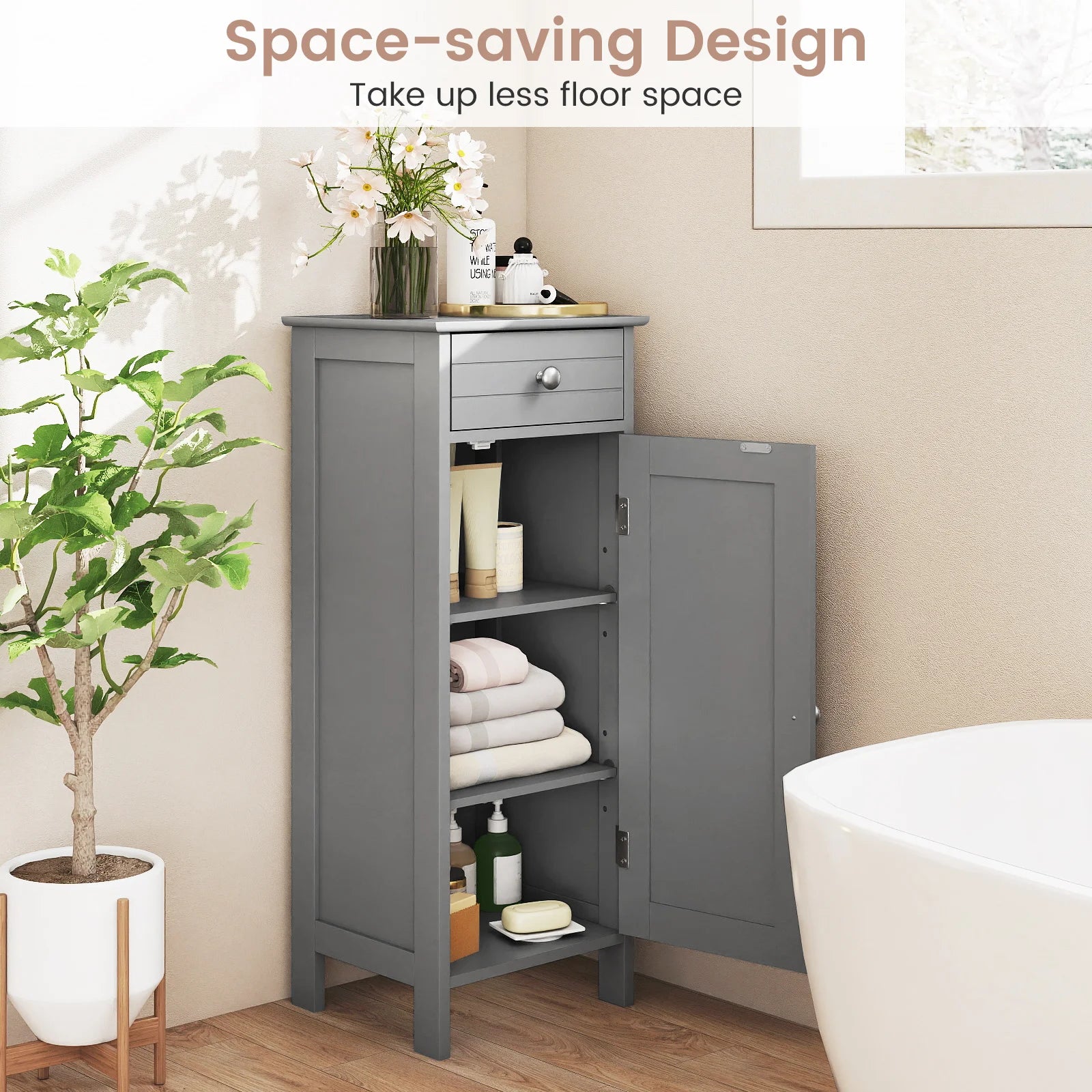 Slim Grey Bathroom Storage Cabinet placed beside a toilet, demonstrating its utility as a narrow 14" gray freestanding organizer for tight corners.