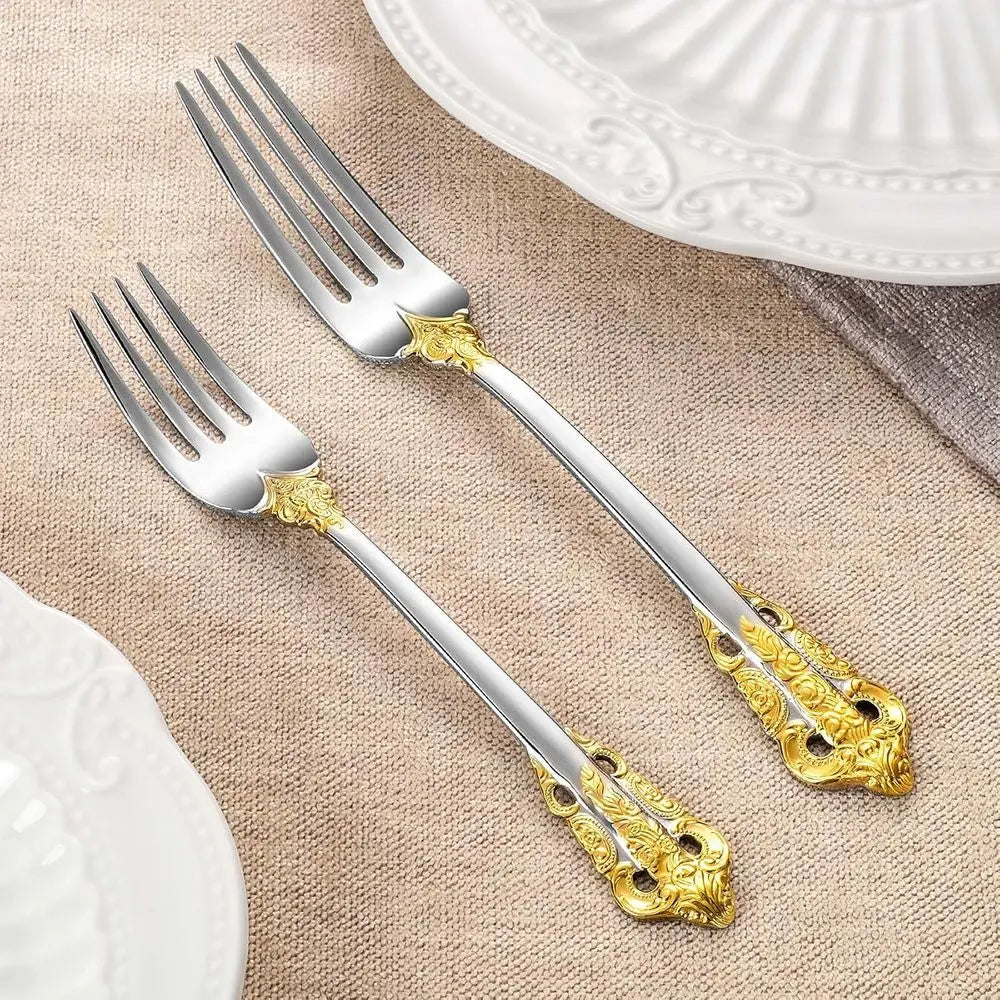 Elegant Everly Quinn Luxury Gold Accent Flatware Set displayed on a beautifully set dining table, emphasizing the luxury flatware set's sleek silver mirror finish.