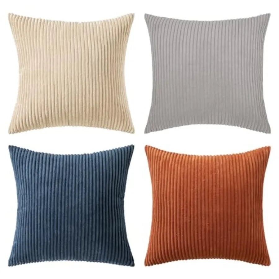 Four ribbed texture throw pillows in beige, gray, blue, and orange on a white background.