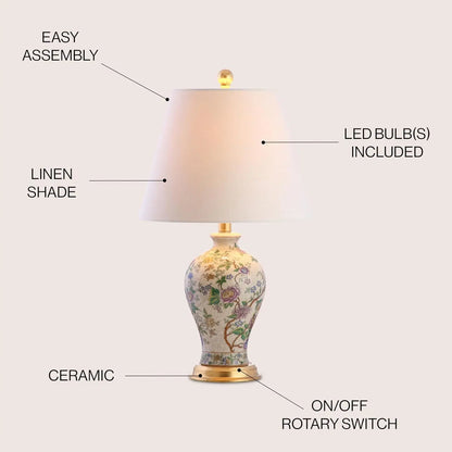 The Elegant 24" Multicolor Ceramic Floral LED Table Lamp with Golden Base illuminated, demonstrating its warm LED glow as a multicolor table lamp for living spaces.
