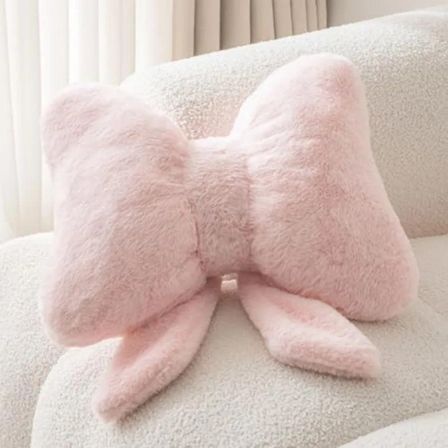 Pink Bow Throw Pillow – Faux Rabbit Fur Bow Cushion for Coquette Aesthetic Bedroom & Sofa Decor displayed on a stylish sofa.