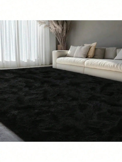 Fluffy Shag Area Rug with abstract tie-dye pattern anchoring a cozy living room setup.