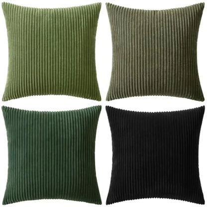 Four square ribbed corduroy throw pillows arranged in a 2x2 grid on a white background, showing green, olive green, dark green, and black color options.