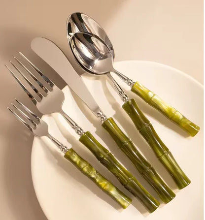 Personalized table setting with Flatware Set featuring stainless steel cutlery and bamboo-style green handles, perfect for entertaining guests.
