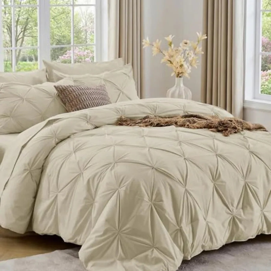 The cozy Queen comforter set features a luxurious pinch pleat pattern, providing both style and comfort in your personal retreat.